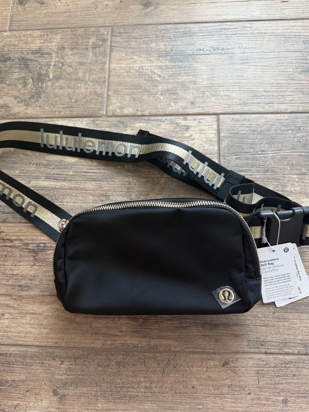 Lululemon Everywhere Belt Bag 1L Wordmark in the Black/Gold colorway